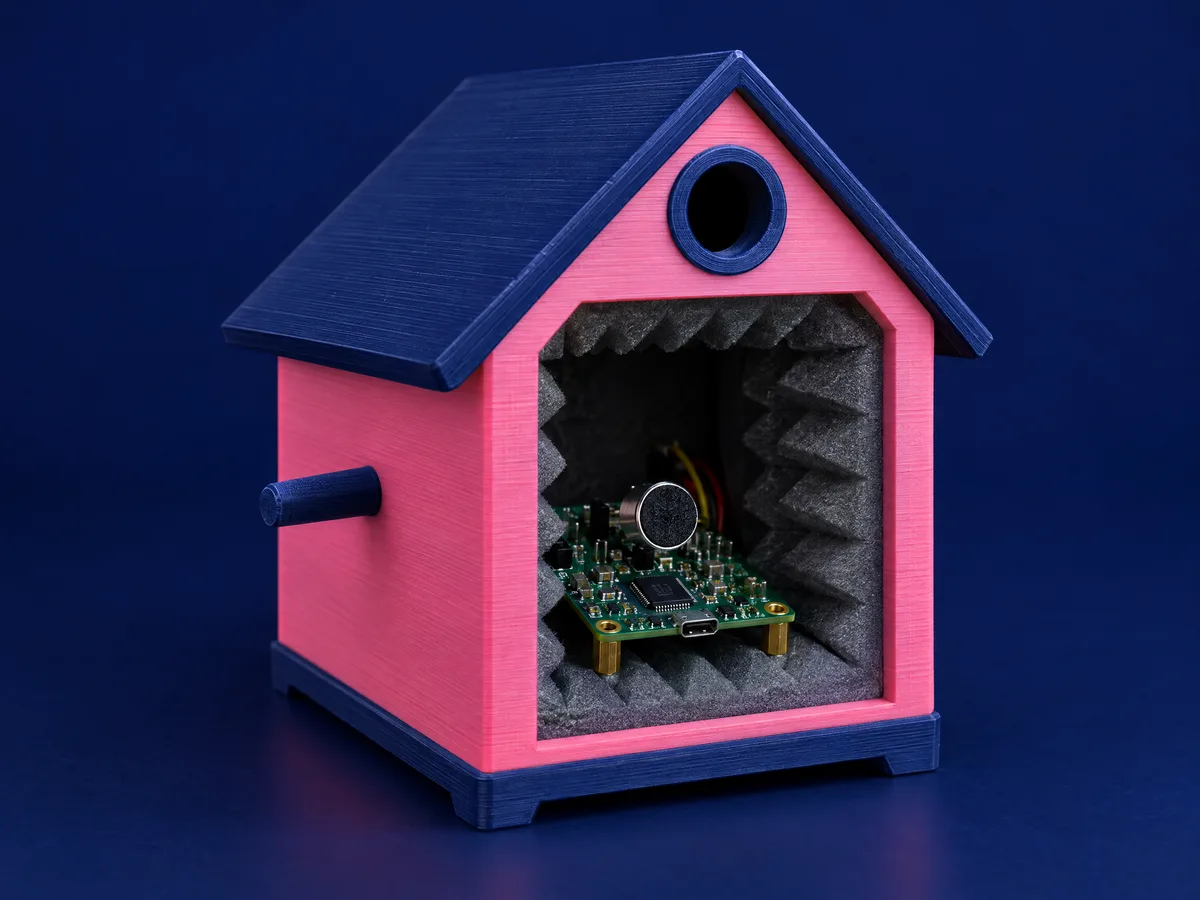 Concept render of a pink 3D-printed acoustic enclosure holding an audio evaluation board