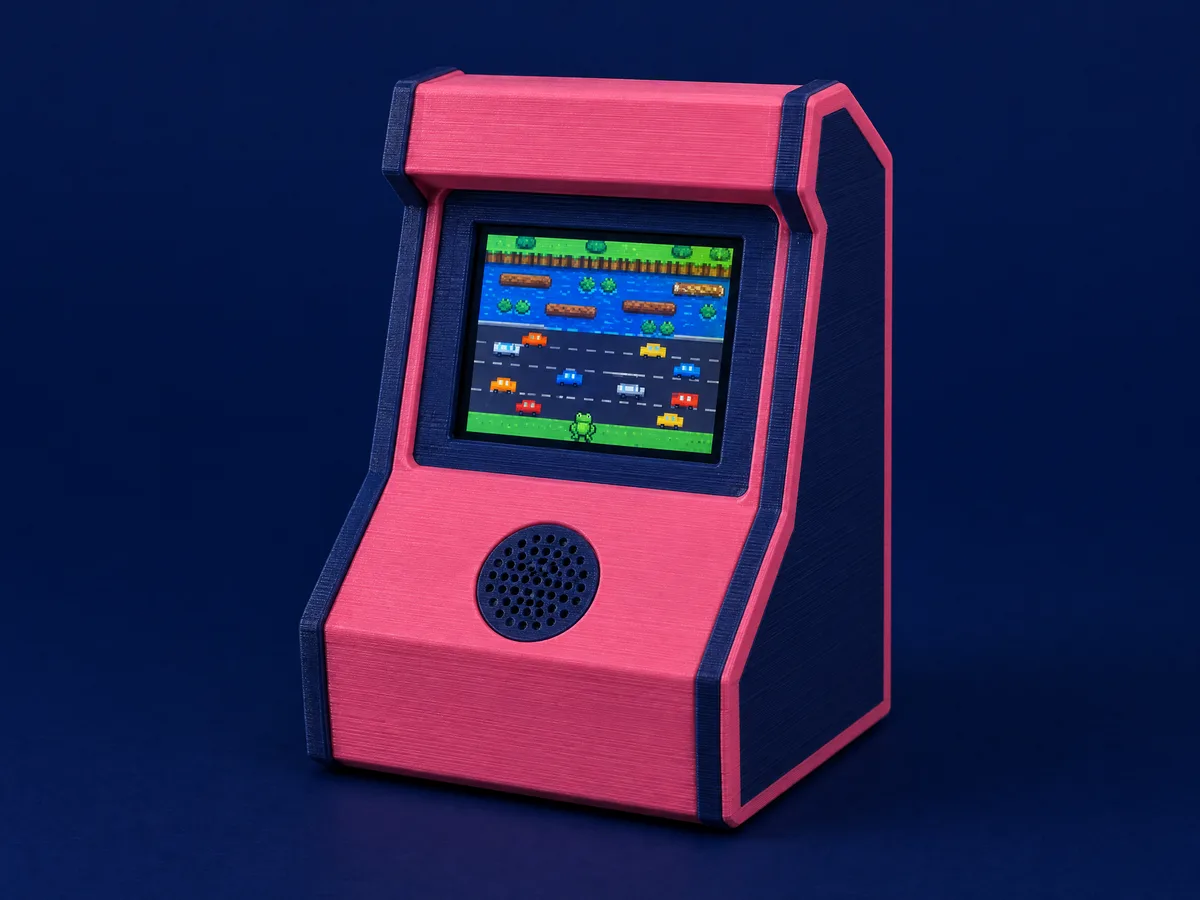 Concept render of a small pink 3D-printed arcade cabinet with a microphone grille